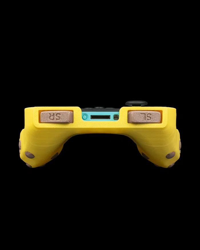 Rear view of a yellow banana-themed controller grip with brown shoulder buttons and a blue center section