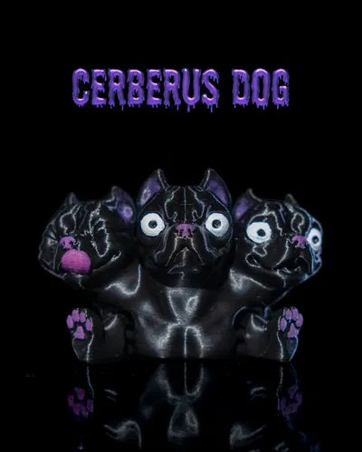 3D-printed Cerberus dog with three black heads, purple accents, and pink tongue