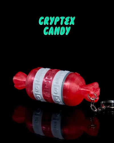 Red and white candy-shaped cryptex toy keychain with secret compartment