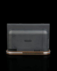 Rear view of a black console dock on a wood-tone base with vent openings