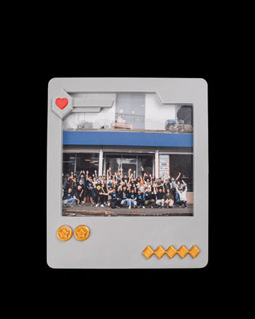 Gray game-card-style photo frame holding a group photo on a black background