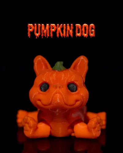 Bright orange dog figurine with jack-o-lantern features and green stem on head