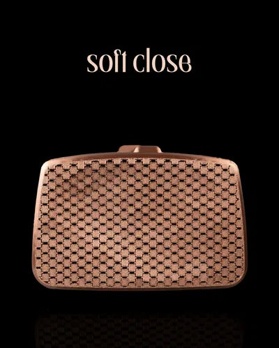 Bronze-toned 3D printed purse with a rectangular shape, soft-close top, and a simple mesh design for minimalist elegance.