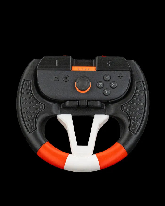 Front view of a black, white, and orange steering wheel grip holding a controller