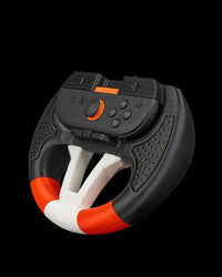 Angled view of a black, white, and orange steering wheel grip holding a controller