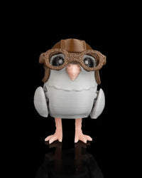 Small gray pigeon figurine with brown goggles and helmet on a black background