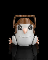 Small gray pigeon figure facing forward with raised brown goggles and pink beak