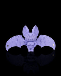 Purple bat figurine with outstretched wings and heart-shaped glasses on a black background