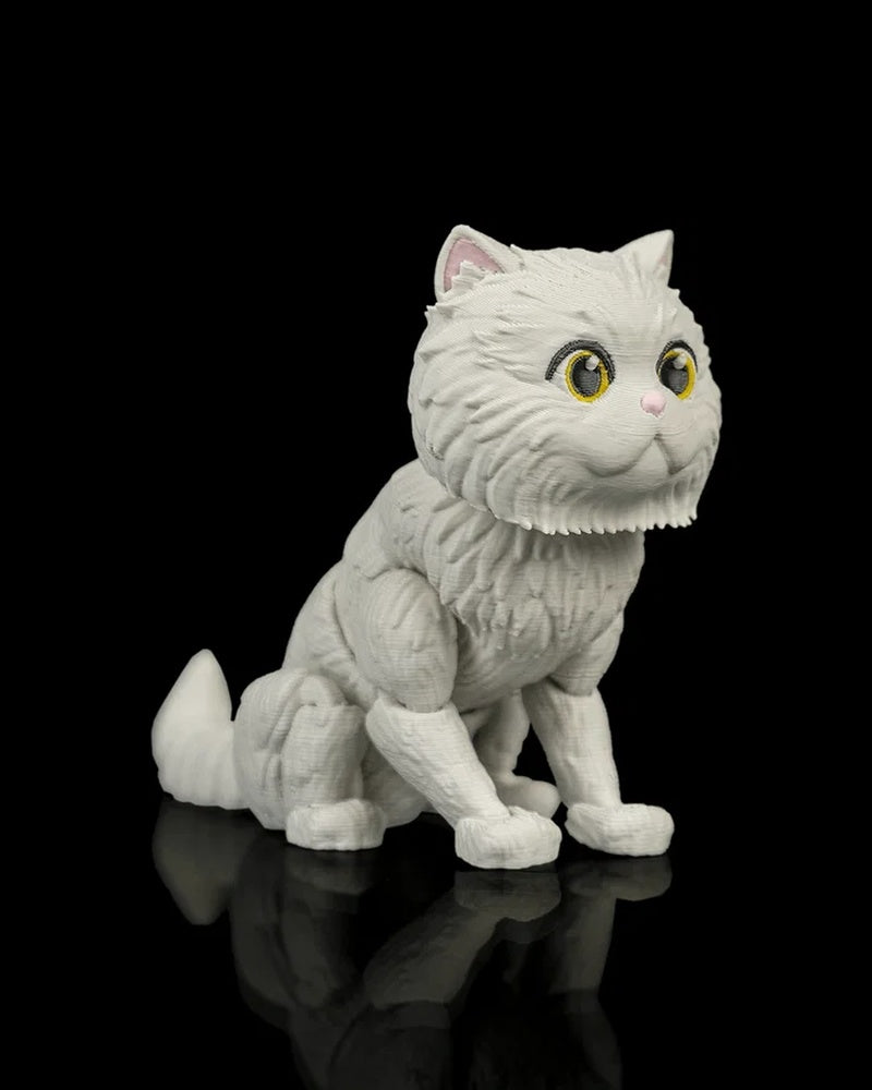 Three-quarter view of a seated white cat figurine with yellow eyes, pink nose, upright ears, and a curled tail