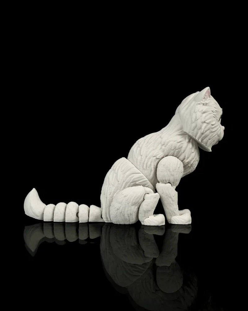 Side view of a seated white cat figurine looking right with a segmented tail on a black reflective surface