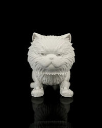 Front view of an all-white crouching cat figurine with narrowed molded eyes on a black reflective surface