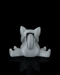 Rear view of a gray cat toy with raised tail, spread legs, and upright ears on a black surface