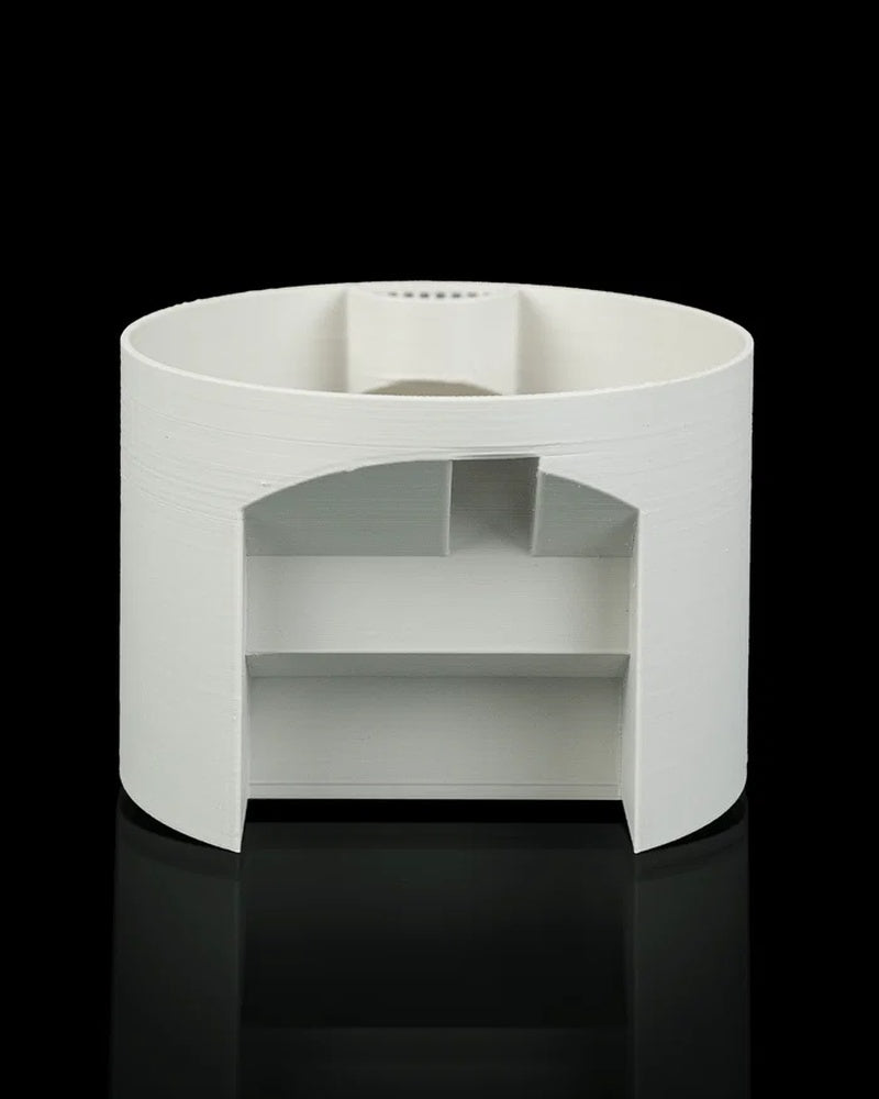 Rear view of a white rounded planter showing an open back section and interior structure