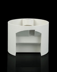 Rear view of a white rounded planter showing an open back section and interior structure