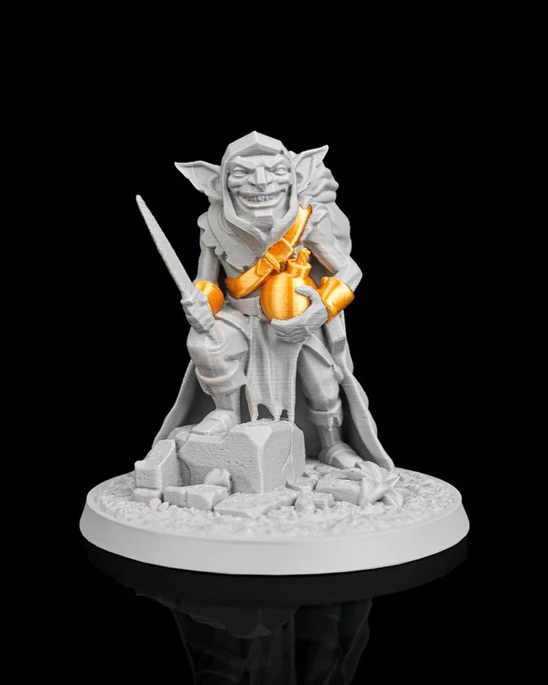 Gray goblin figurine with orange bomb accents, a blade, and a round scenic base on a black background