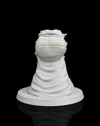Rear view of a gray goblin figurine with a large pack and cloak on a round base