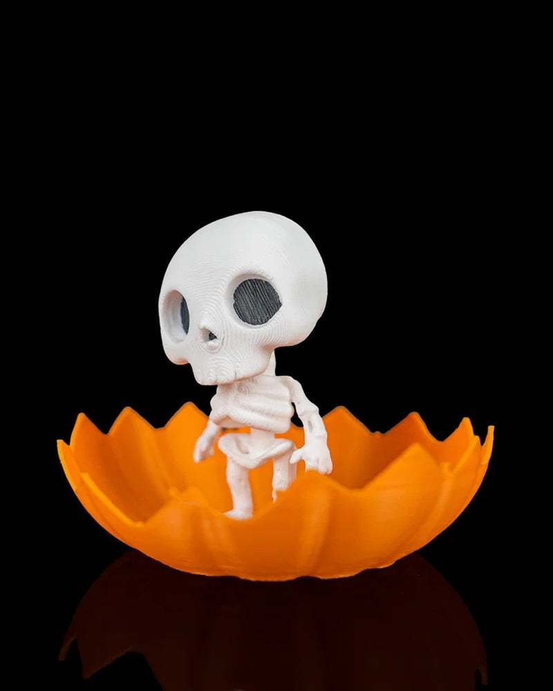 Angled view of a white skeleton figure standing in an orange pumpkin shell on a black background
