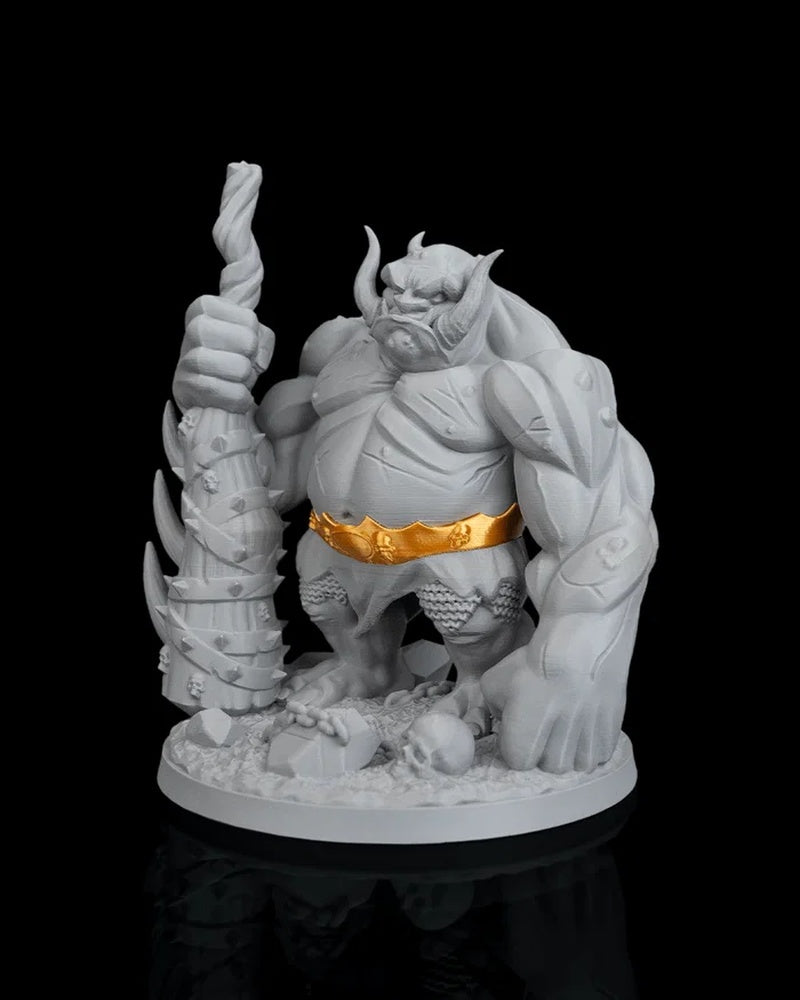 Front angled view of a grey troll figurine with tusks, a gold belt, and a large club
