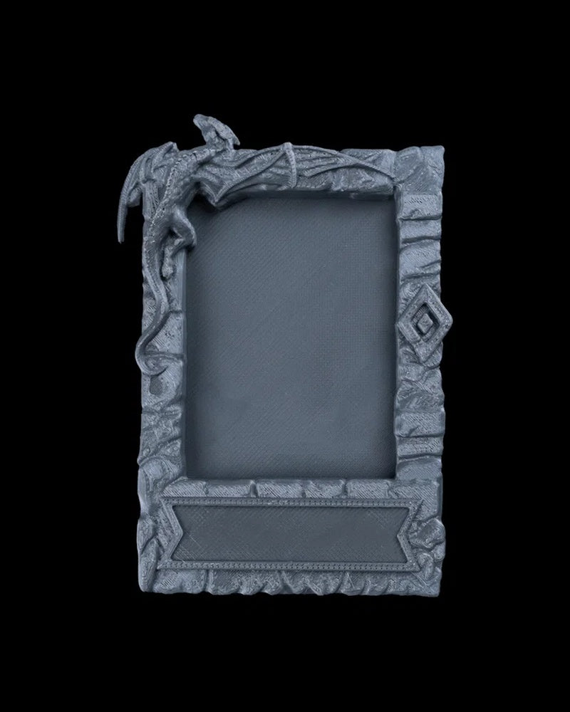 Gray dragon-themed photo frame with an empty center opening on a black background