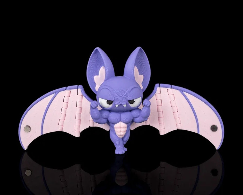 Purple bat figurine with pink wings, large ears, fangs, and muscular body on a black background