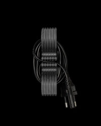Gray ridged cord holder with a black cord looped around it on a black background