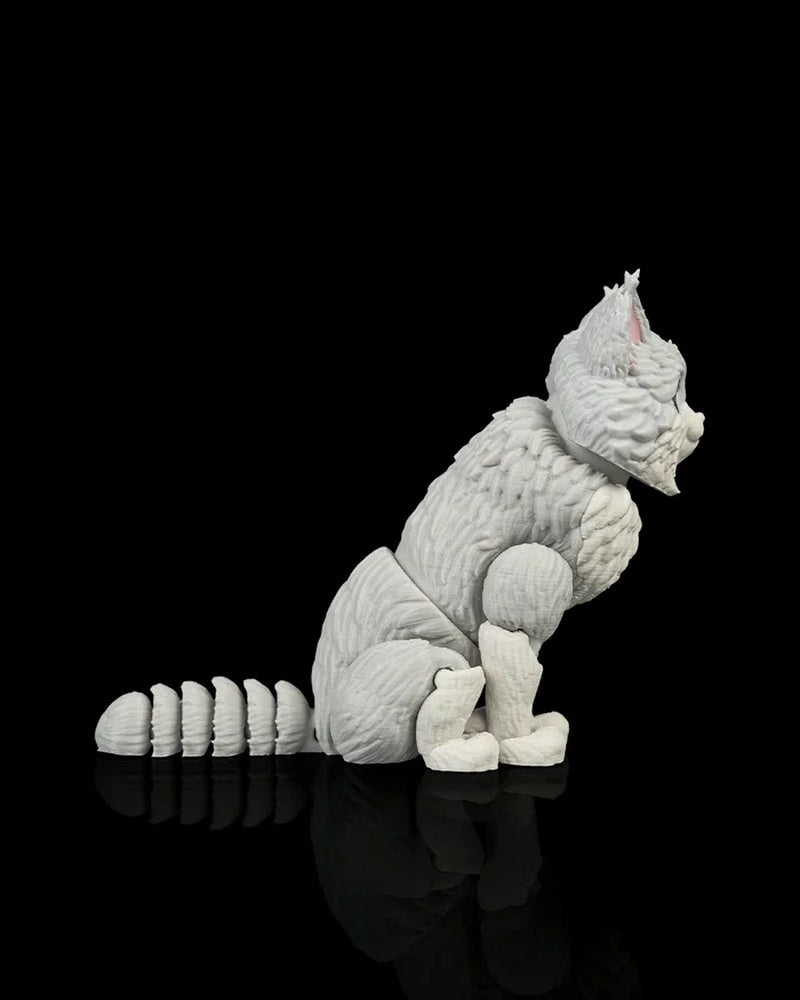 Side view of a gray-and-white cat figurine with a segmented curled tail on a black background
