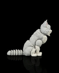 Side view of a gray-and-white cat figurine with a segmented curled tail on a black background