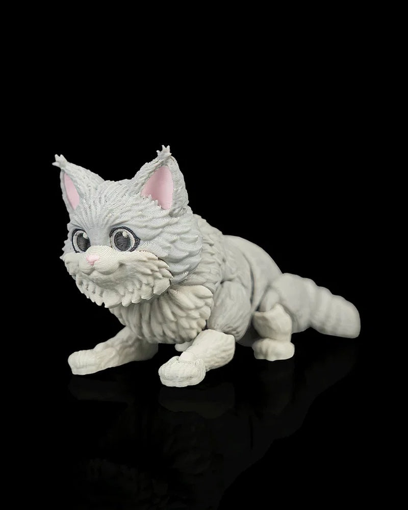 Low angled view of a gray-and-white cat figurine posed forward with a curled tail