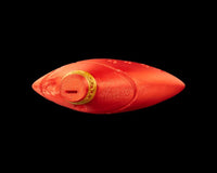 Top view of a red ocarina-shaped figurine with a gold-toned ring detail and a narrow slot