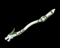 White and green dragon-shaped flute figurine on a black background