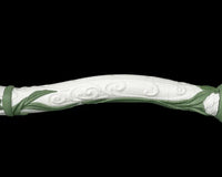 Close-up of a curved white body section with green leaf accents and swirl details