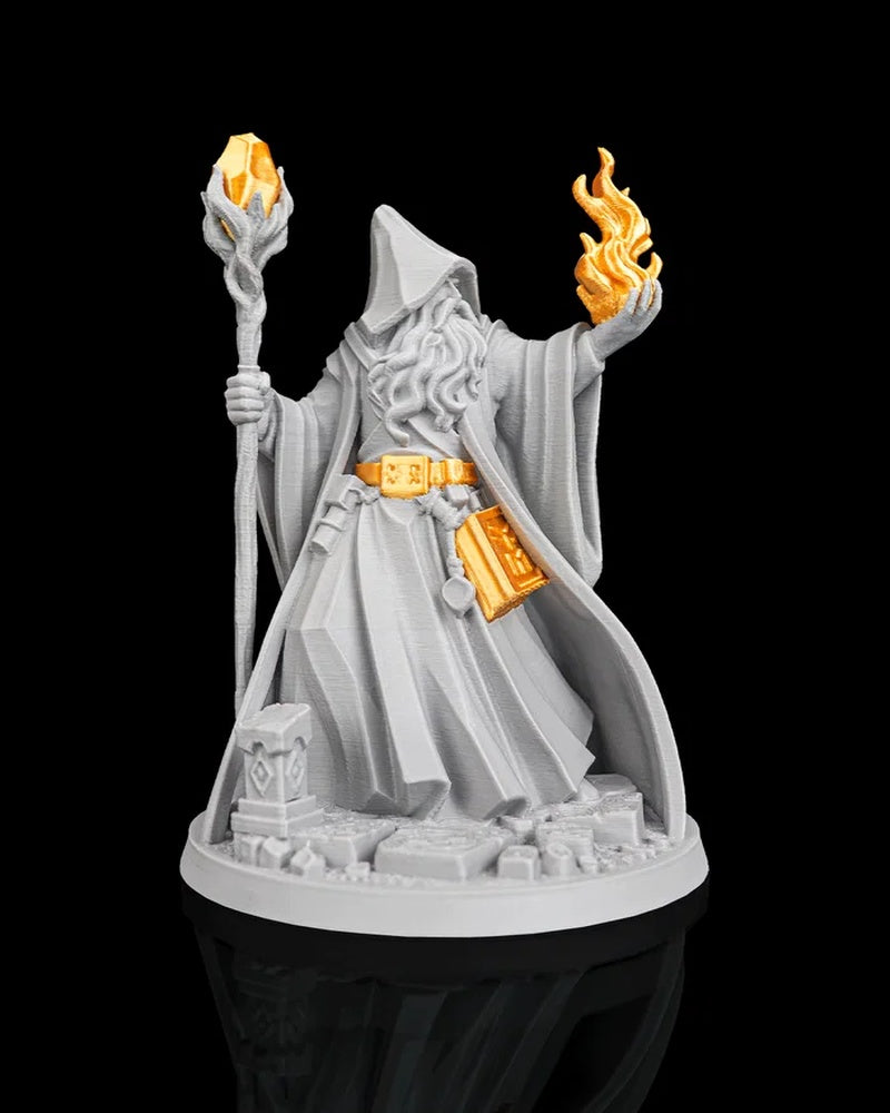 Hooded wizard figurine holding a staff with an orange crystal and a raised orange flame on a round base