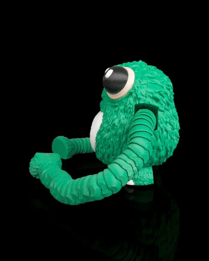 Side view of a green frog fidget with large eyes, a white belly, and curled segmented arms