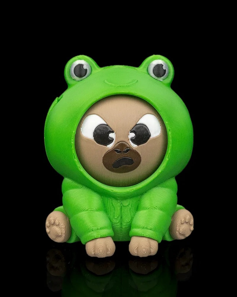 Front view of a green frog-themed capybara figurine with an angry face on a black background.