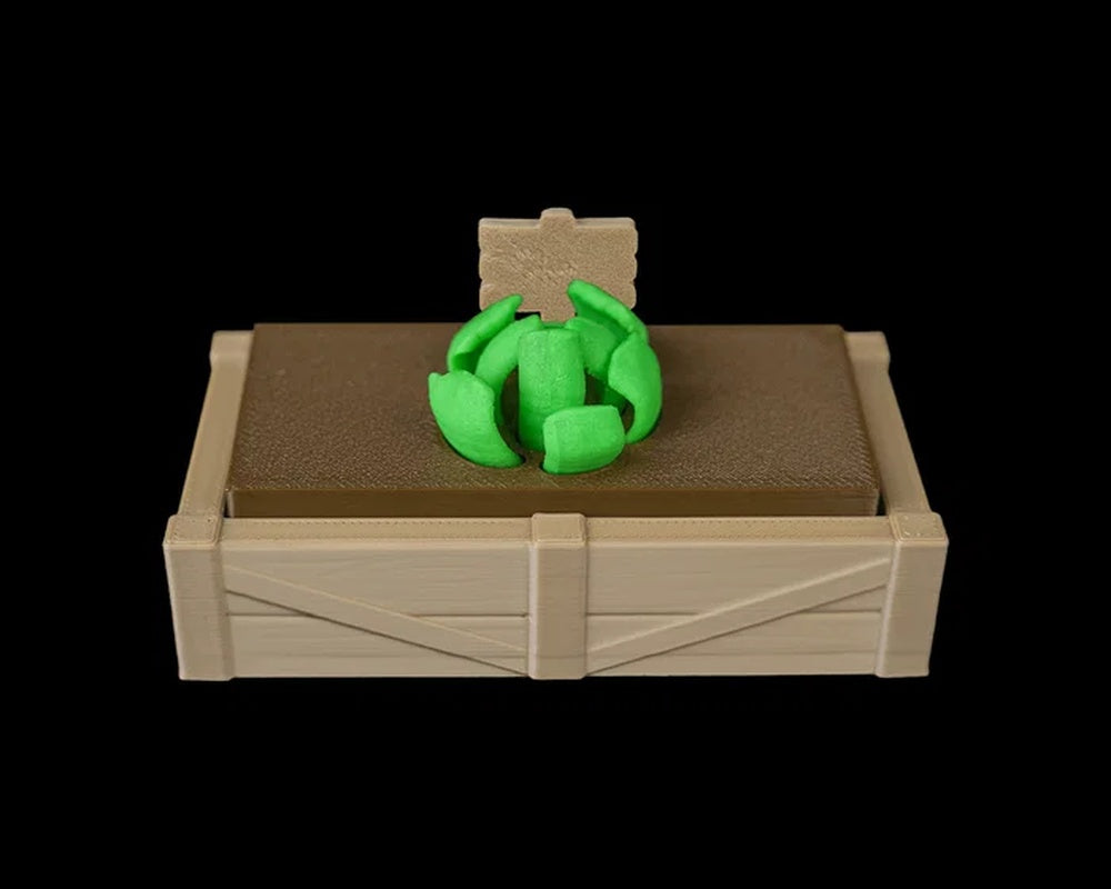 Tan garden bed tray with a brown soil insert, small sign, and green sprout shape on top.