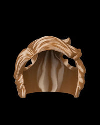 Brown wave-styled headpiece shown from the front on a black background.
