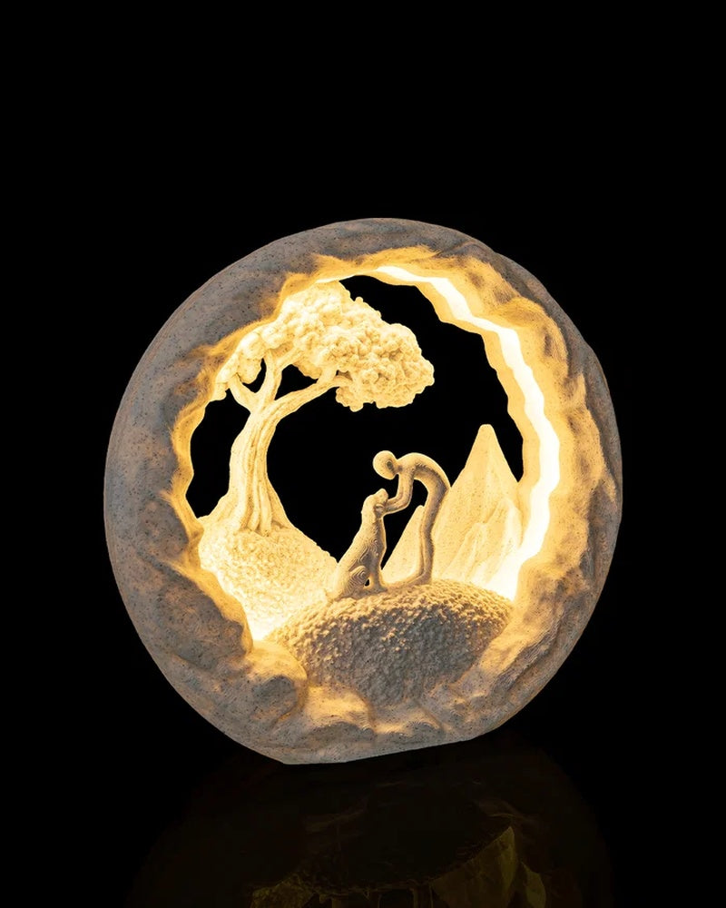 Glowing round lamp viewed from an angle with a dog and tree scene inside