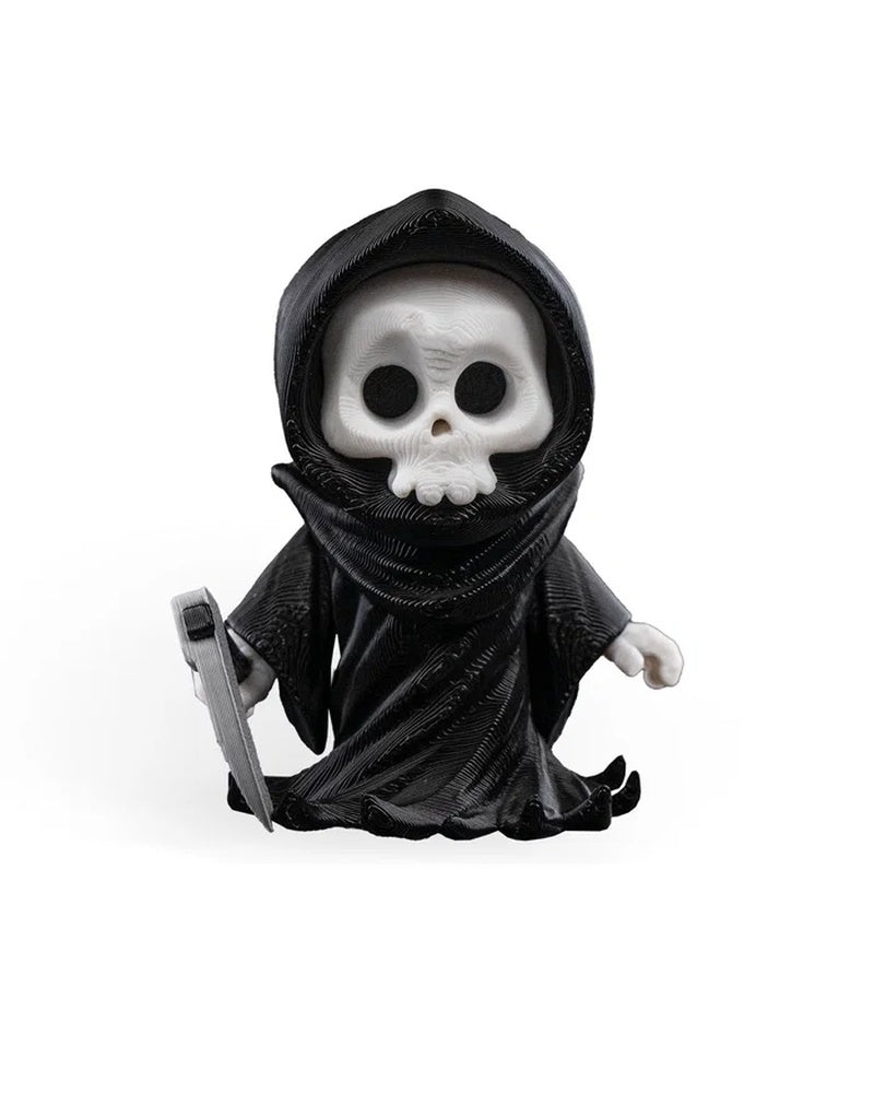 Front view of a black hooded skull figure holding a gray blade-like prop on a white background.
