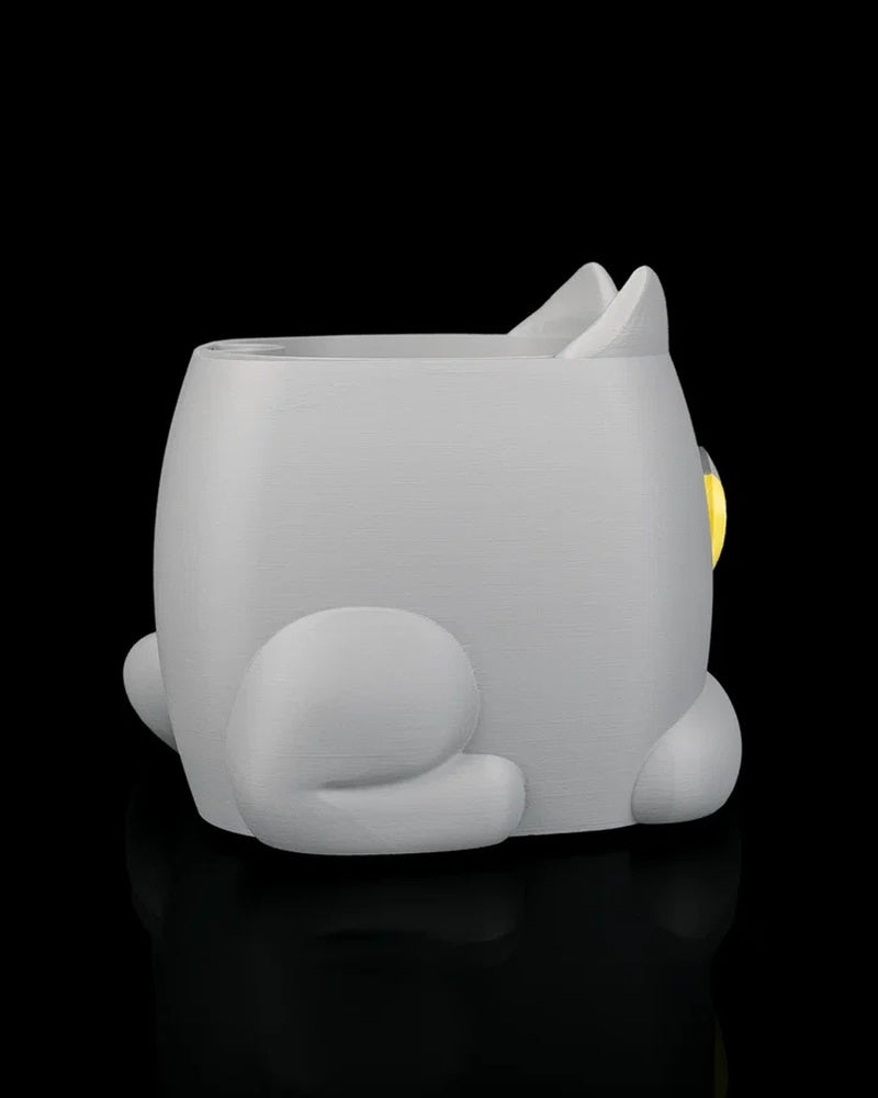 Rear angled view of a gray cat-shaped planter with a curled tail and side paw