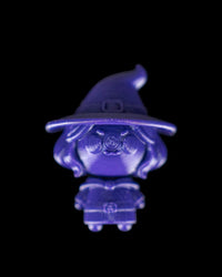 Monochrome blue witch character with a pointed hat on a black background