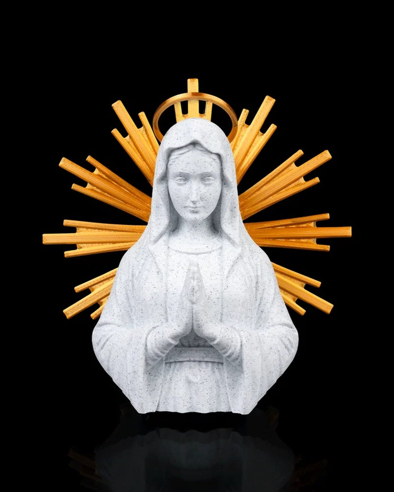 Front view of a Mary figurine with hands in prayer, a white veil, and gold-toned rays behind her on a black background
