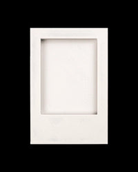 Empty white rectangular photo frame with recessed opening on a black background