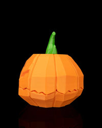 Side-back view of an orange pumpkin object with a green stem on a black background