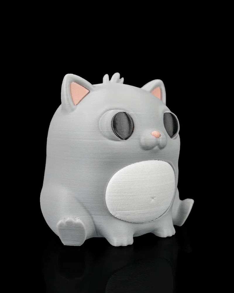 Angled front view of a gray cat figure with a white belly, dark eyes, pink ears, and small paws.