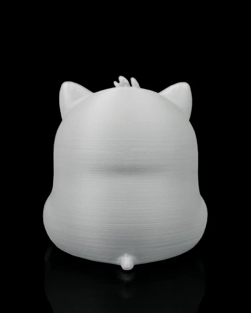 Rear view of a gray cat figure showing pointed ears, a small tail, and a rounded back.