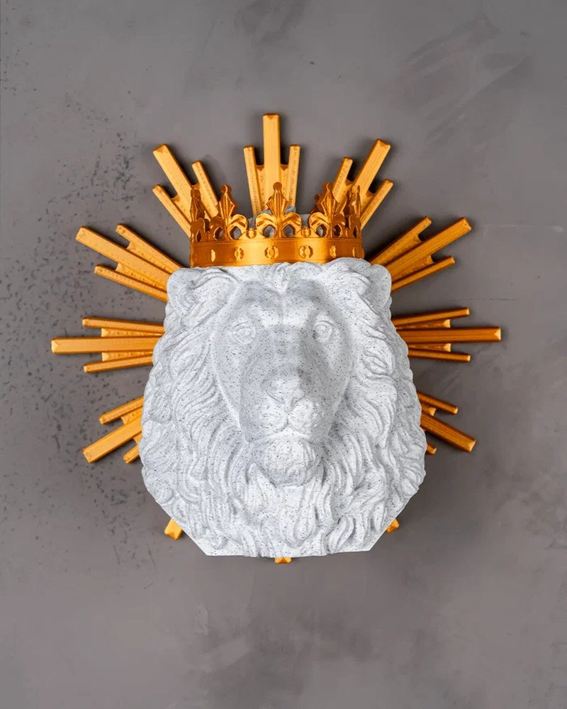 Front view of a white lion head figurine with a gold crown and gold rays on a gray background