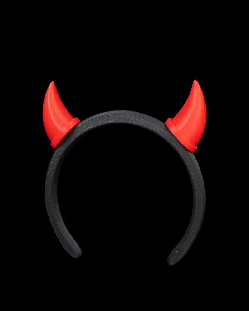 Black headband with two red horns on a black background.