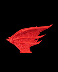 Side view of a red wing piece on a black background.