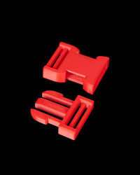 Two red buckle-like pieces on a black background.