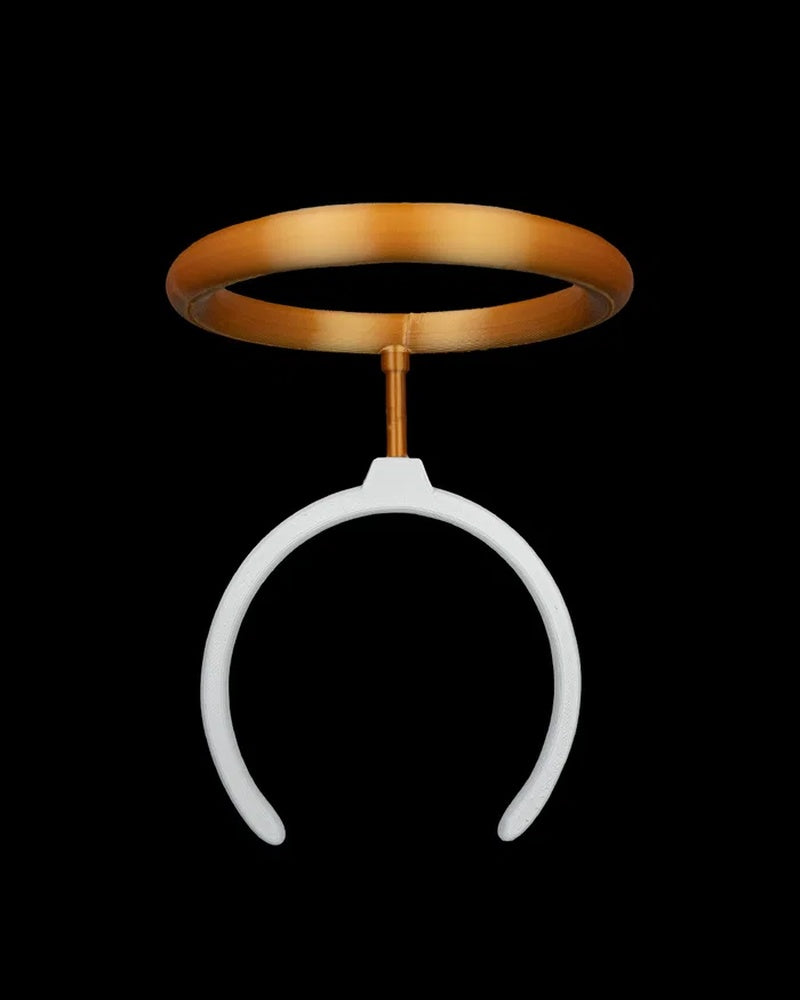 White curved headband with a gold halo ring on a black background